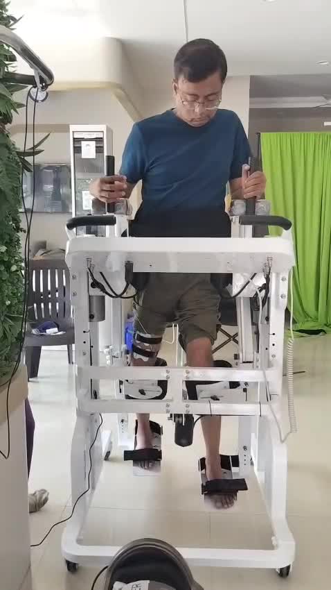 Patient using advanced robotic gait training system with therapist supervision